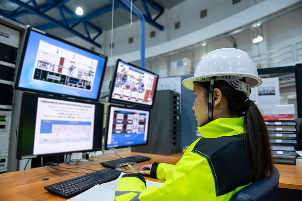 logistics worker planning deliveries at a computer